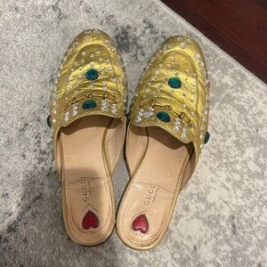 Gold mules from Gucci